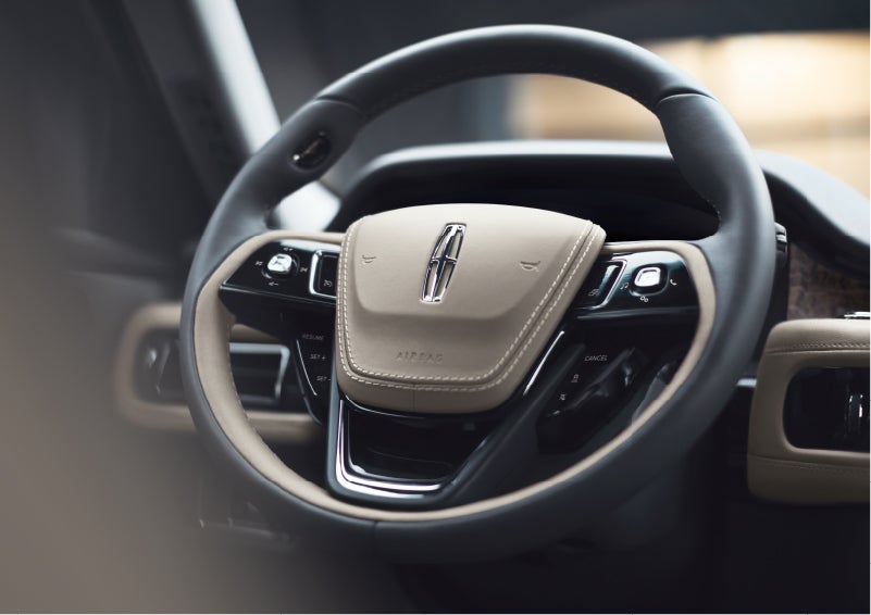 The intuitively placed controls of the steering wheel on a 2023 Lincoln Aviator® SUV | Karl Malone Lincoln in El Dorado AR