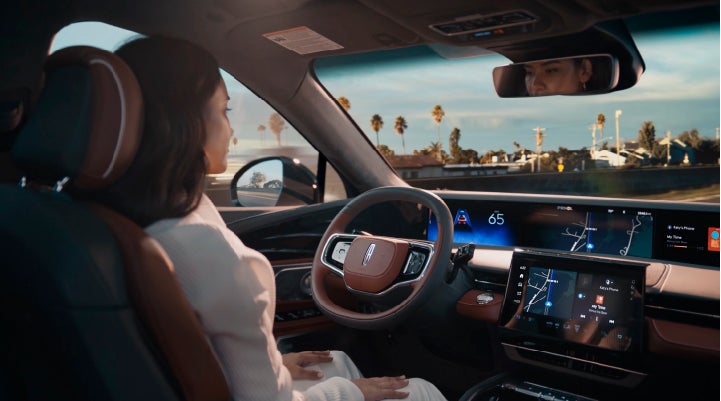 A person is shown driving hands-free on the highway with available Lincoln BlueCruise technology. | Karl Malone Lincoln in El Dorado AR
